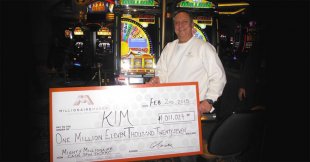 Kim poses with his giant cheque for , 011, 027 at Caesars Windsor on Feb. 2, 2015. (Handout by Caesars Windsor/The Windsor Star)